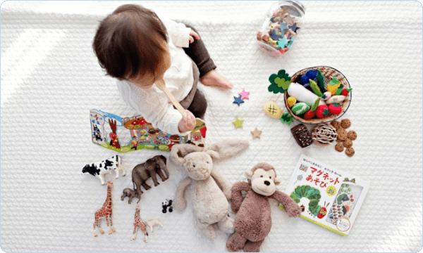 Baby with toys laid out