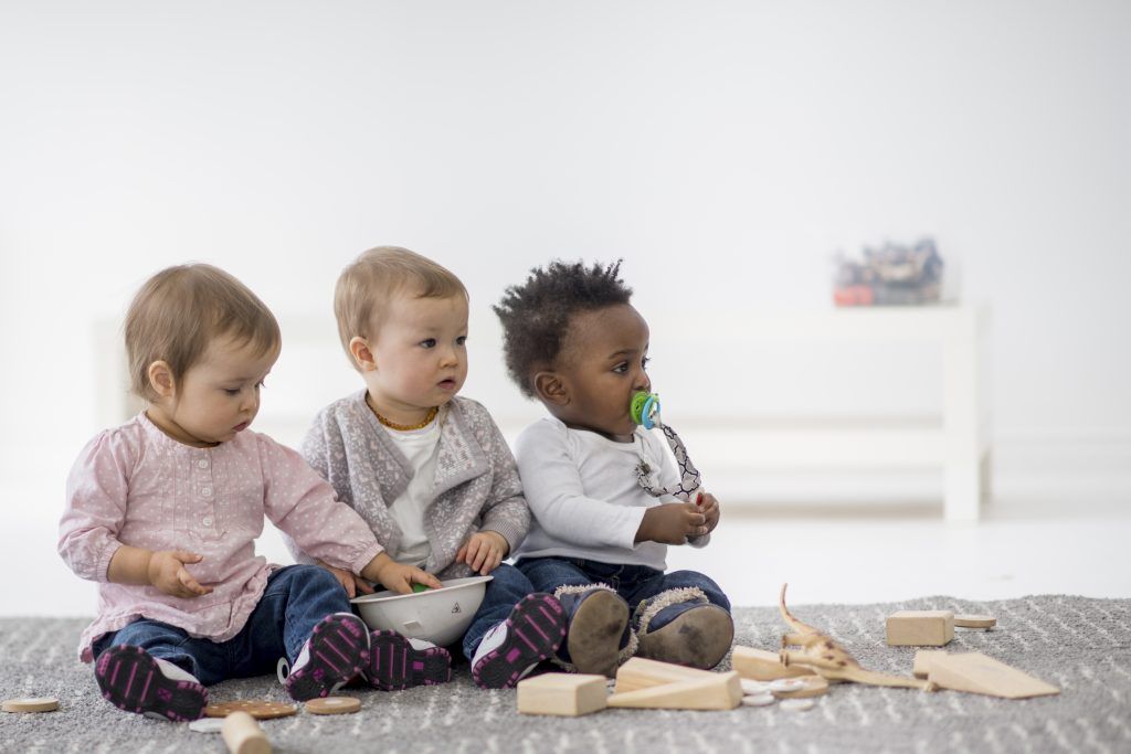 Babies playing together in preschool.