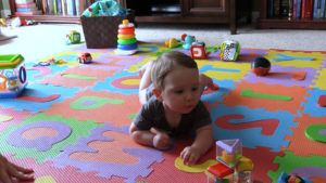 baby looking at toys during tummy time