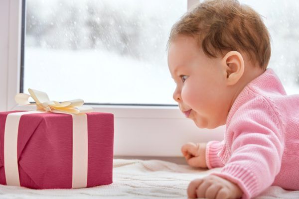 baby_girl_looking_at_present