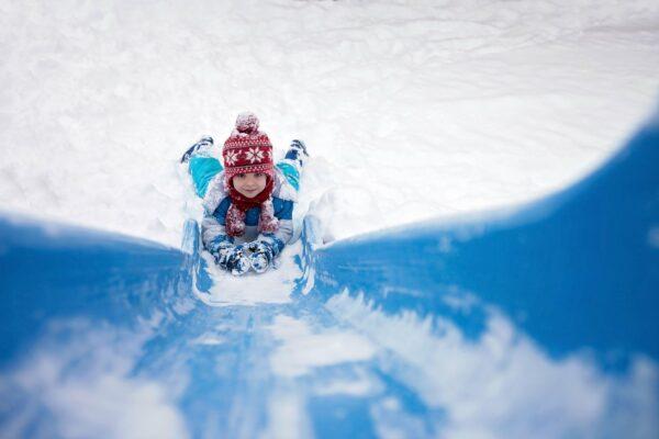 boy_going_down_snowy_slide