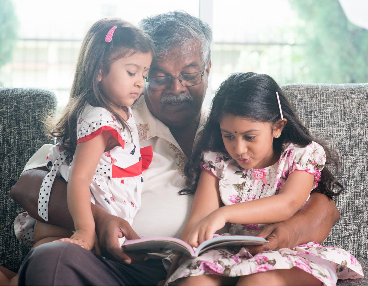 indian_kids_grandpa_reading_book_together