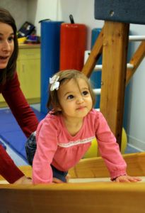 little_girl_climbing_up_slide