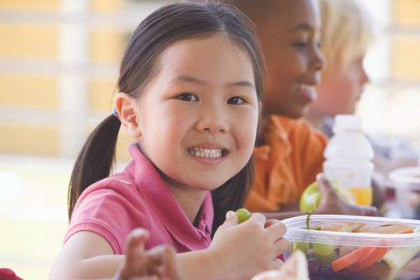 little_girl_eating_grapes_at_school