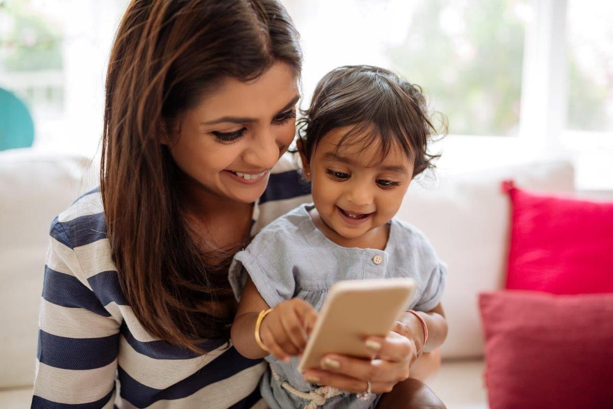 mom and boy playing on phone