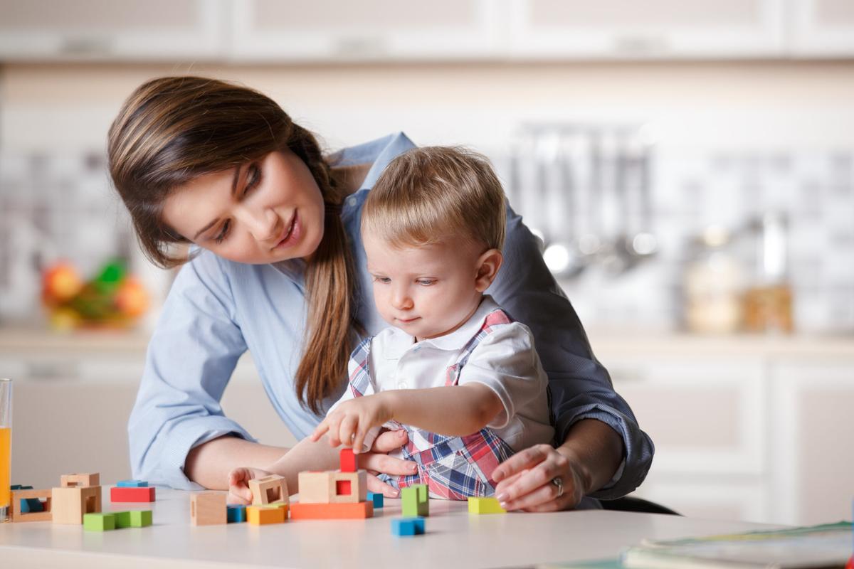 Mom playing with blocks with her baby