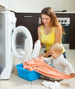 toddler_helping_mom_with_laundry