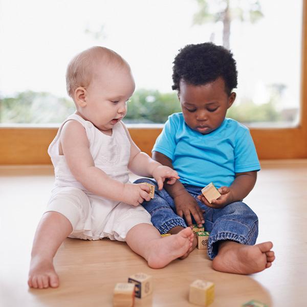 Help baby learn by pairing them up with other babies and encouraging group play