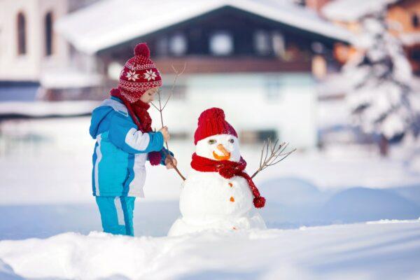 young_child_building_snowman