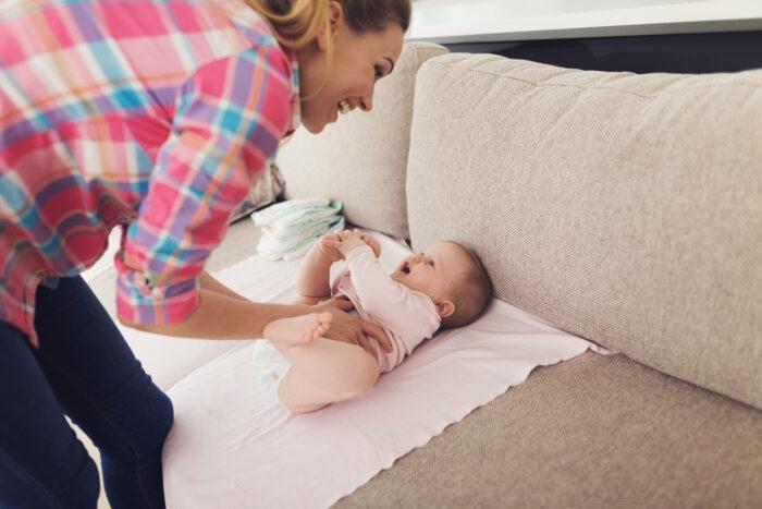 mother_swaddles_baby