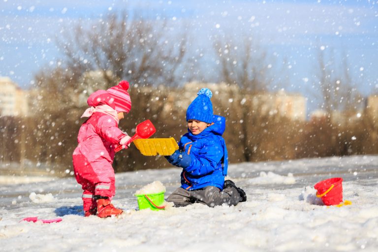 Improve Gross Motor Skills This Winter Pathways Org   Two Children Playing With Shovels In The Snow 768x512 