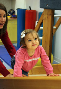 little_girl_climbing_up_slide