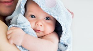 baby_wrapped_in_blue_towel