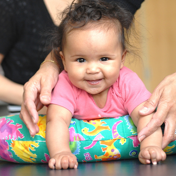 Baby doing Tummy Time on a pillow