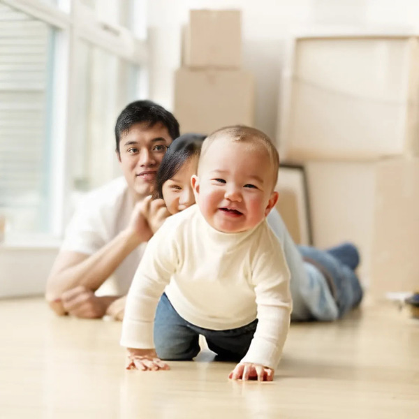 family_moving_in_new_house_baby_crawling