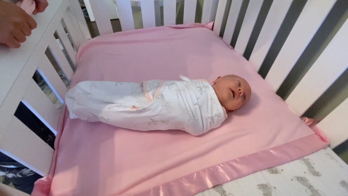 Some babies will calm down and even laugh when you swaddle them