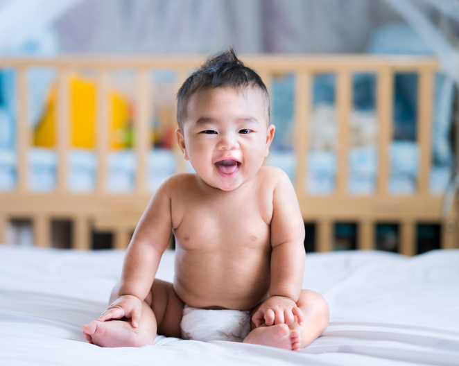 smiling newborn baby boy