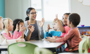 preschool-teacher-and-students-in-classroom