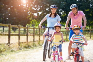 Family riding bikes together outdoors