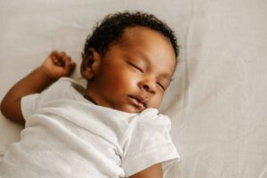 Newborn sleeping in crib